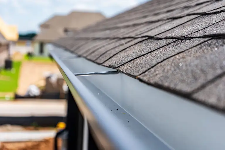 An ELSA Roofing crew at work on a residential roof
